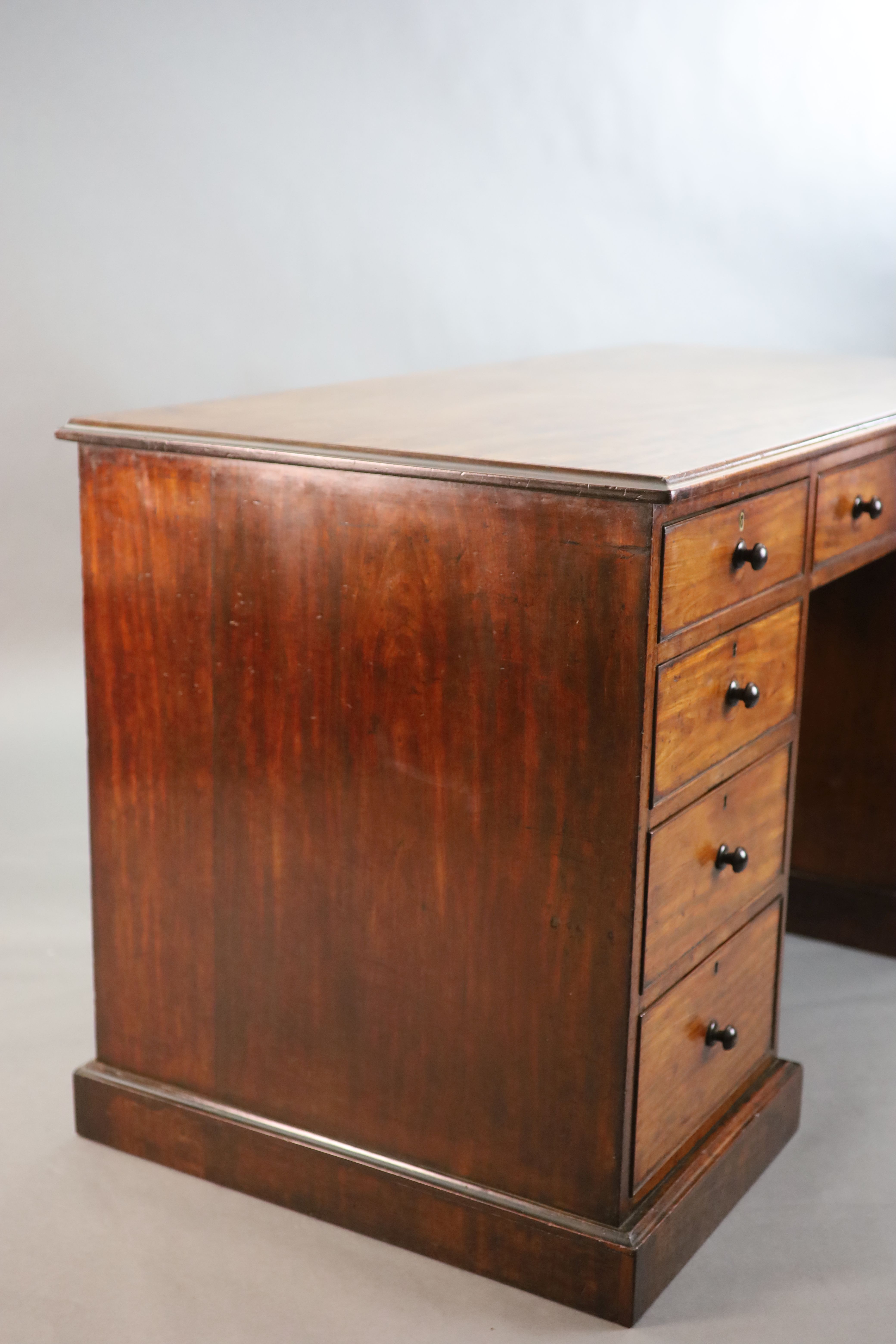 A George III mahogany kneehole desk, W.4ft 8in. D.2ft 2in. H.2ft 7in.